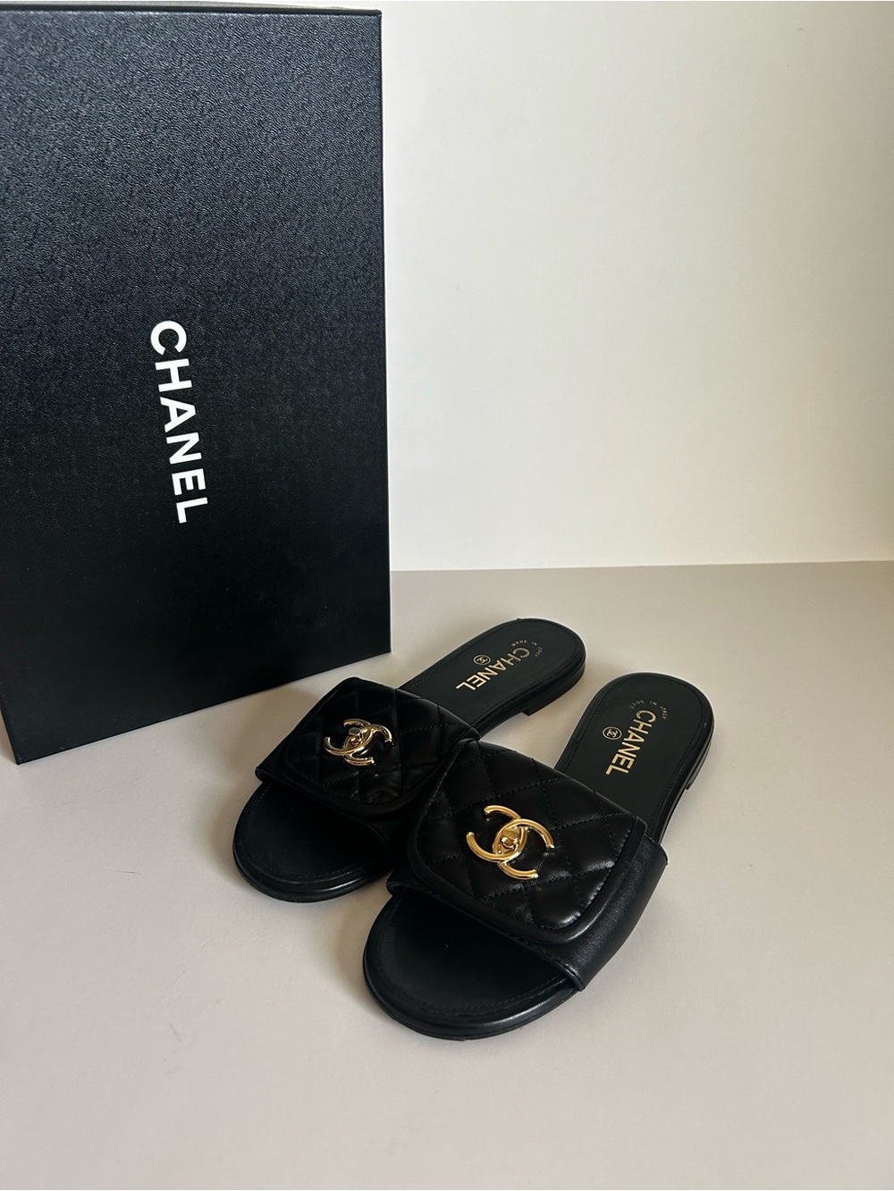 CHANEL Black Quilted Leather Slides with Gold CC Emblem